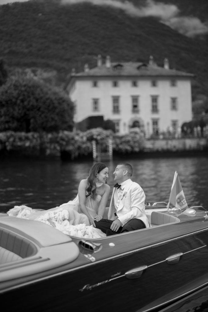 A + J taking a speed boat following their Villa Balbiano Wedding Ceremony in Lake Como